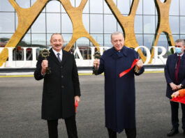 Azerbaijani President Ilham Aliyev and Turkish President Recep Tayyip Erdogan holding the symbolic keys of the newly opened Fuzuli International Airport on October 26..